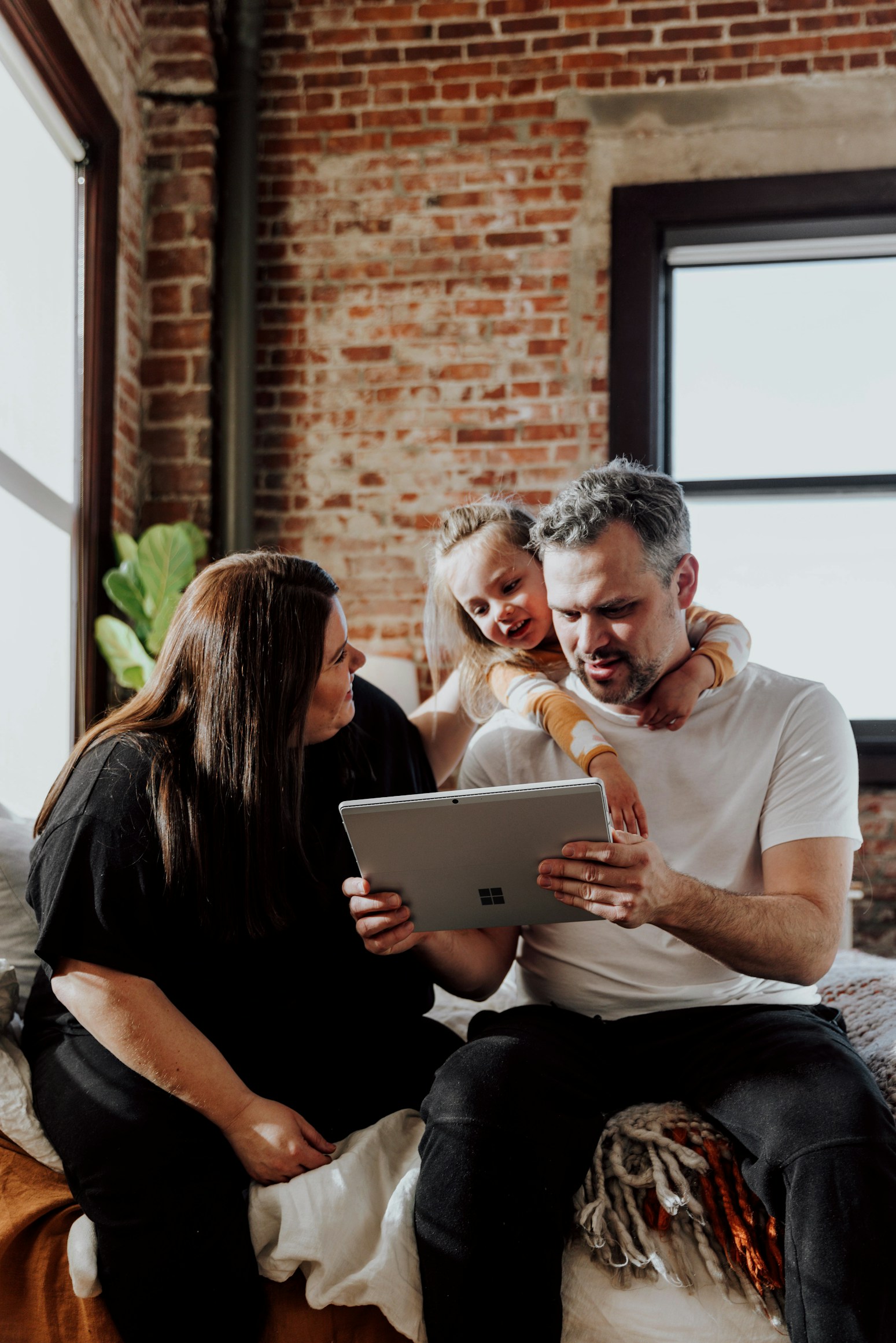 Family watching live service on a tablet
